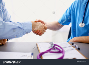stock-photo-attractive-female-doctor-shaking-a-patient-s-hands-in-her-office