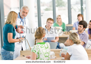 stock-photo-medicine-students-with-professor-and-heart-anatomical-model