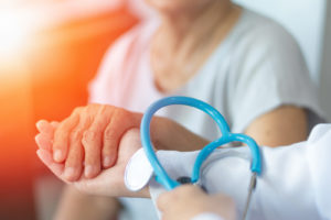 Doctor Holding the hand of a patient
