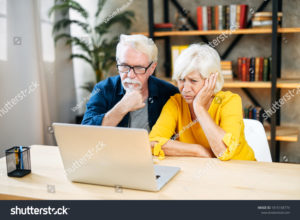stock-photo-an-elderly-couple-is-looking-puzzled-on-the-laptop-screen-a-senior-couple-confused-with-some-news