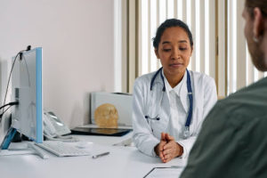 A doctor meeting with a patient to discuss whole body donation